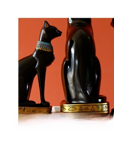 Macro detail of Egyptian cat statue base with golden hieroglyphic engravings