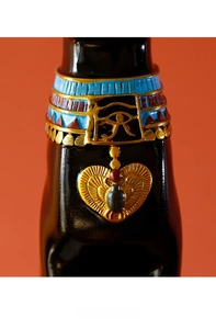 Detail of Bastet cat statue with golden scarab pendant and hand-painted Horus eye collar
