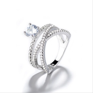 Sparkling double-layered silver ring with crisscross design and brilliant zirconia accents