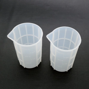 Detail of 250ml silicone measuring cup with clear scale marks and pouring spout