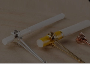Detailed view of rose flower cigarette holders in silver gold and rose gold metal finishes