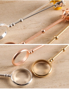 Detailed views of rose smoking ring holders in gold, silver and rose gold finishes