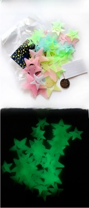 Detailed view of luminous 3cm star wall stickers with adhesive dots and night glow effect