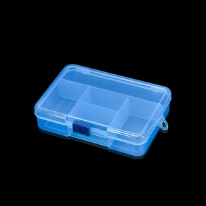 Detail view of transparent blue 5-compartment plastic storage box on a reflective black background