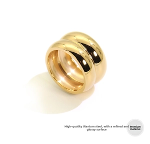 Macro shot of 18K gold plated wide titanium steel ring with polished mirror finish