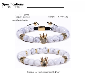 Detail of 8mm white howlite bead bracelet with gold crown and micro zircon charm
