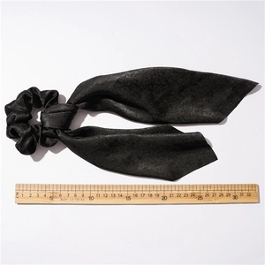 Black satin ribbon hair scrunchie with long bow, 30cm length on white background