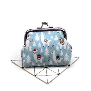 Detail of vintage metal clasp and winter alpaca print on blue fabric coin purse