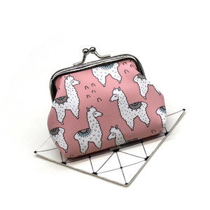 Detail of pink canvas coin purse with llama print and retro metal clasp closure