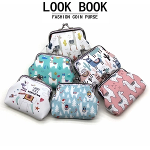Detailed view of stacked alpaca and unicorn coin purses with vintage metal clasp closure