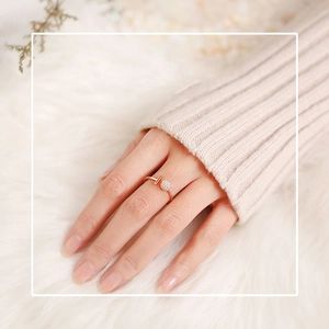 Close-up of gold adjustable ring featuring a T-shape and pavé zircon crystal ball on hand
