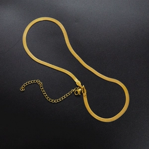 Flat 18K gold plated herringbone chain choker with lobster clasp on black background