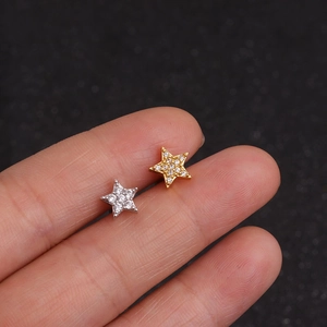 Detail of star-shaped stud earrings with micro-pave cubic zirconia on fingertips