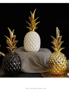 Modern ceramic pineapple ornaments in black, white, and gold for luxury home decor