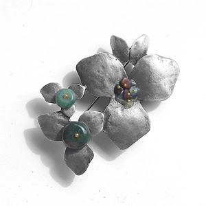 Vintage silver flower brooch with green gemstones and multicolored stones for women