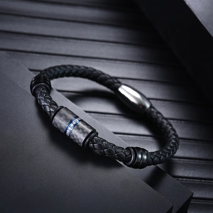 Men's black braided leather bracelet with blue carbon fiber and gemstone inlay details