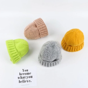 Women's warm winter knit beanies in four vibrant colors with thick ribbed fold-over design