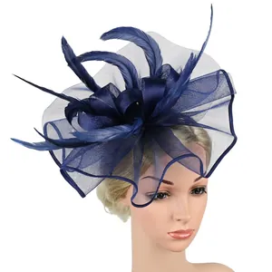 Elegant navy blue mesh fascinator with feathers on a mannequin for formal wedding attire