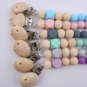 Silicone and wood baby pacifier clip set with six colorful teething bead chains