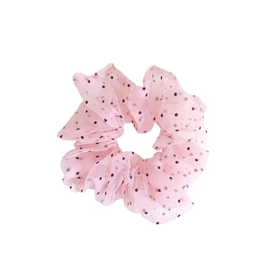 Oversized pink organza hair scrunchie with black polka dots on a clean white background