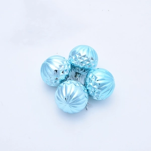 Detail of light blue Christmas balls with vertical ridges and rhombic textures set of 4