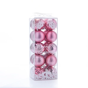 Pink and rose gold Christmas balls in transparent box with matte and glitter textures