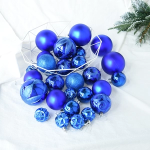 30-piece mixed royal blue Christmas ball ornaments set displayed on white fabric background