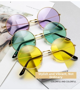 Close-up of retro round sunglasses with purple green and yellow lenses in gold frames