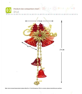 Close-up of red Christmas bells hanging ornament with gold Merry Christmas lettering