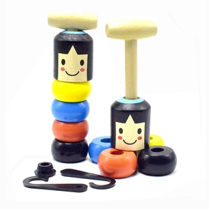 Detail of wooden magic daruma toy set featuring colorful stacking blocks and wooden hammers