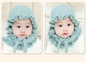 Detail view of the soft ruffled knit texture on a sage green baby winter bonnet