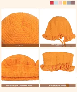 Close-up of orange knitted baby hat featuring double-layer thickness and ruffle edge details