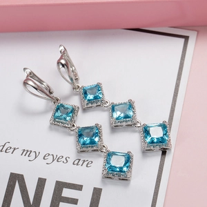Elegant silver earrings with three-tier blue square zircon stones in high-end design