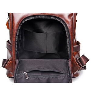 Deep brown soft faux leather backpack with large capacity and interior compartments