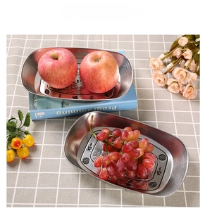 Oval retro metal food tray set with fruit and vintage floral cafe print on tablecloth