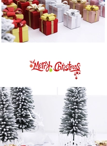 Close-up of glittered Christmas gift boxes with miniature frosted trees and deer ornaments
