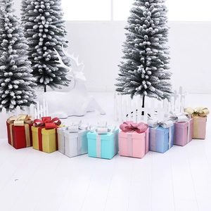Set of glittery festive gift boxes in multiple colors for Christmas holiday window decor
