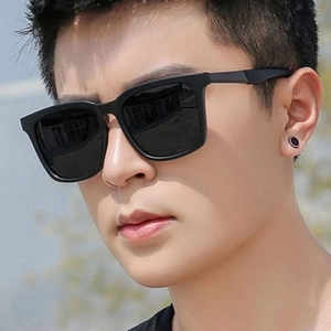 Classic men's square black frame sunglasses with minimalist design on a male model