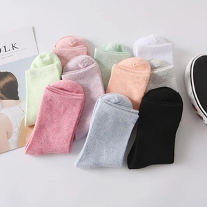Colorful mid-calf cotton socks collection in multiple solid colors for daily wear