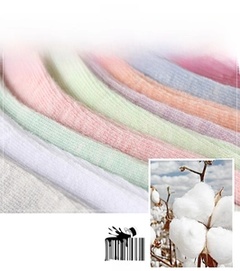 Macro detail of breathable soft cotton socks in colorful pastel shades with cotton flower
