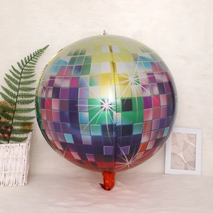 Detail of colorful 4D disco ball aluminum balloon on a soft white carpet background