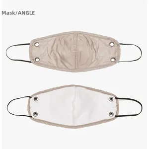 Detail view of winter mask showing khaki fabric surface with silver metal rivets