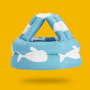 Detailed view of breathable cotton baby safety helmet with blue whale pattern