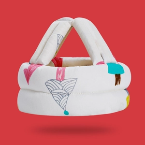 Close-up of baby safety helmet with tree patterns and soft padded double-layer design