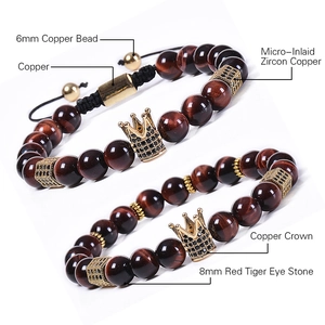 Detailed view of 8mm red tiger eye stone beads and a micro-pave zircon crown charm