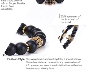 Detail of 8mm matte black stone beads and gold crown charm with cubic zirconia inlay