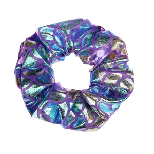 Detail of fish scale pattern hair scrunchie with shiny purple and gold metallic fabric