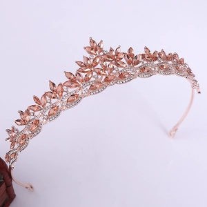 Luxurious rose gold bridal crown featuring marquise-cut champagne crystals in leaf design