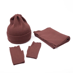 Close-up of three-piece rib knit set including beanie, scarf and fingerless gloves in red