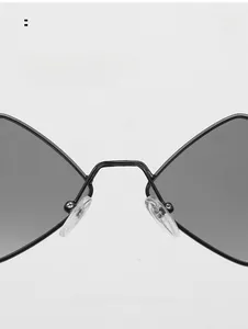 Detailed macro shot of comfortable silicone nose pads on trendy metal diamond sunglasses